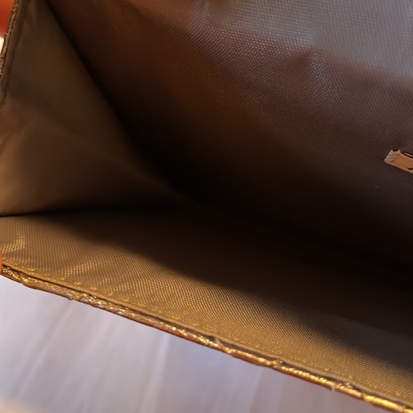 Neiman Marcus wristlet. Silver. Shine pulls bronze or gray depending. 9.5”x5.5” - Picture 5 of 8